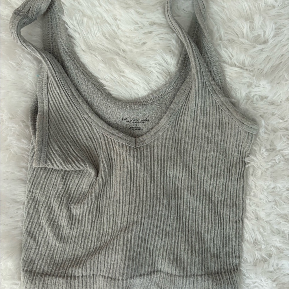 Out from under light blue tank top